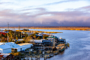 Apalachicola, Florida from the bridge over the Apalachicola River with purple storm clouds in the background.