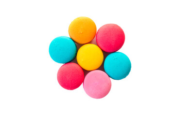 Multicolored macaroons standing on a blue plate on a wooden floor