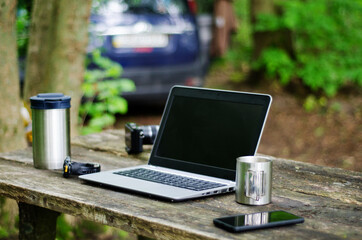 Computer Coffee Mug and Telephone on black wood table.