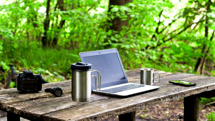 Computer Coffee Mug and Telephone on black wood table.
