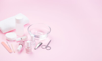 Spa set equipment for manicure or pedicure with nail coat or polish, on pink background, horizontal, copy space