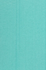 Fototapeta premium Teal textured cardboard paper closeup background