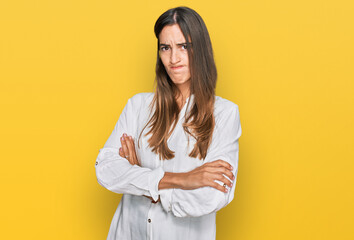 Young beautiful woman wearing casual clothes skeptic and nervous, disapproving expression on face...
