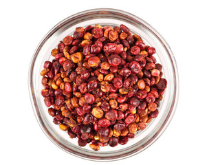 Whole Dry Sumac (Rhus) Berry Seed in a Glass Bowl. Top View. Isolated on White Background.
