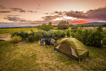 Camping in a tent on the nature with bikes