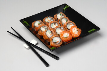 Japanese Food Sushi Set in Black Plate on the Table
