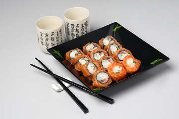 Japanese Food Sushi Set in Black Plate on the Table
