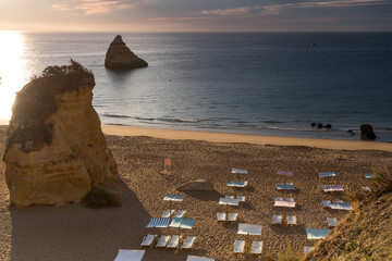 Sun beds on the beach. Early morning, no people. Lagos, Algarve Coast, Portugal