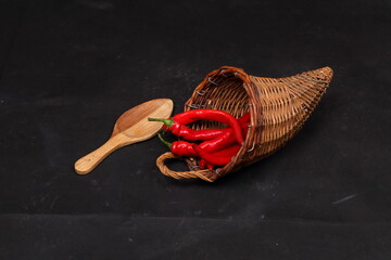 pepper on wooden spoon