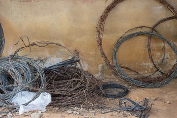 Rolls of used barbed wire used for building cattle fences