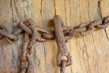 Old, rusted, corroded chain used on a farm
