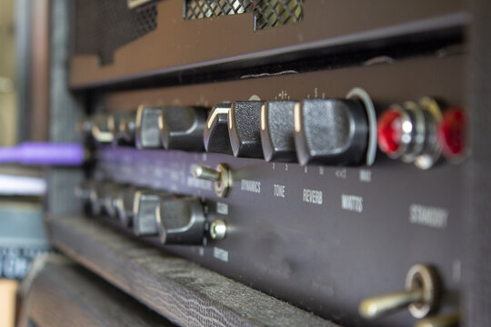 Buttons, knobs and lights of a guitar amplifier