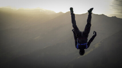 Fototapeta na wymiar Skydivers perform stunts over Swiss Alps