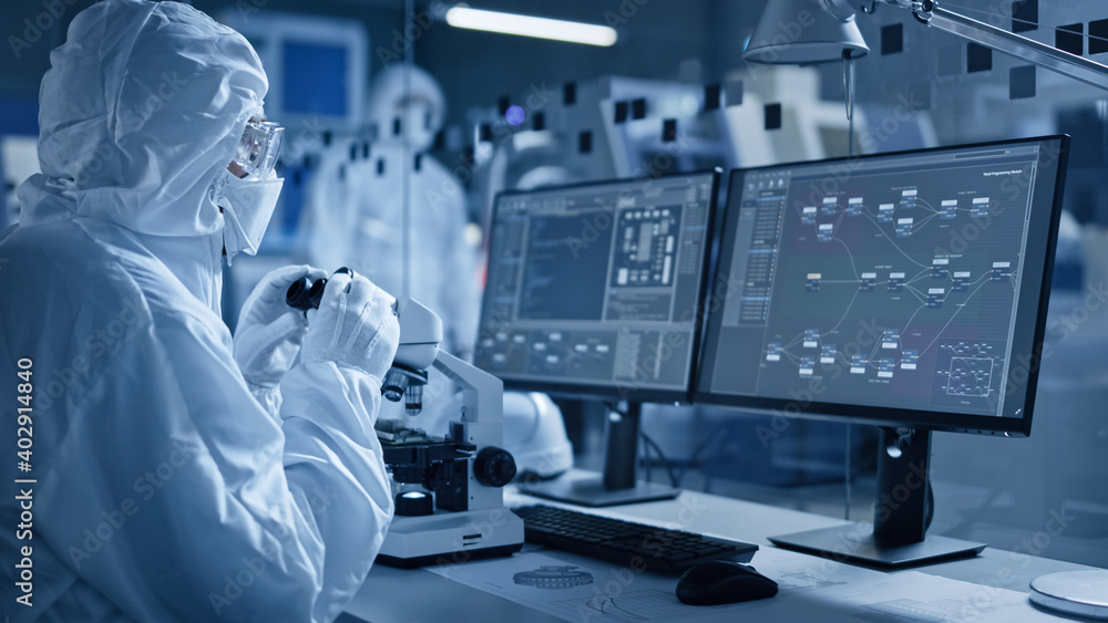 Poster research factory cleanroom: engineer / scientist wearing coverall and gloves use microscope to inspe