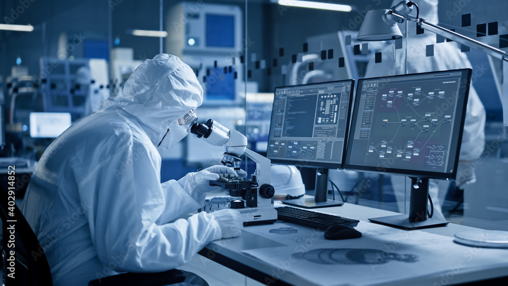 Aufkleber Research Factory Cleanroom: Engineer / Scientist wearing Coverall and Gloves Use Microscope to Inspect Motherboard Microprocessor Component, Developing High Tech Modern Electronics