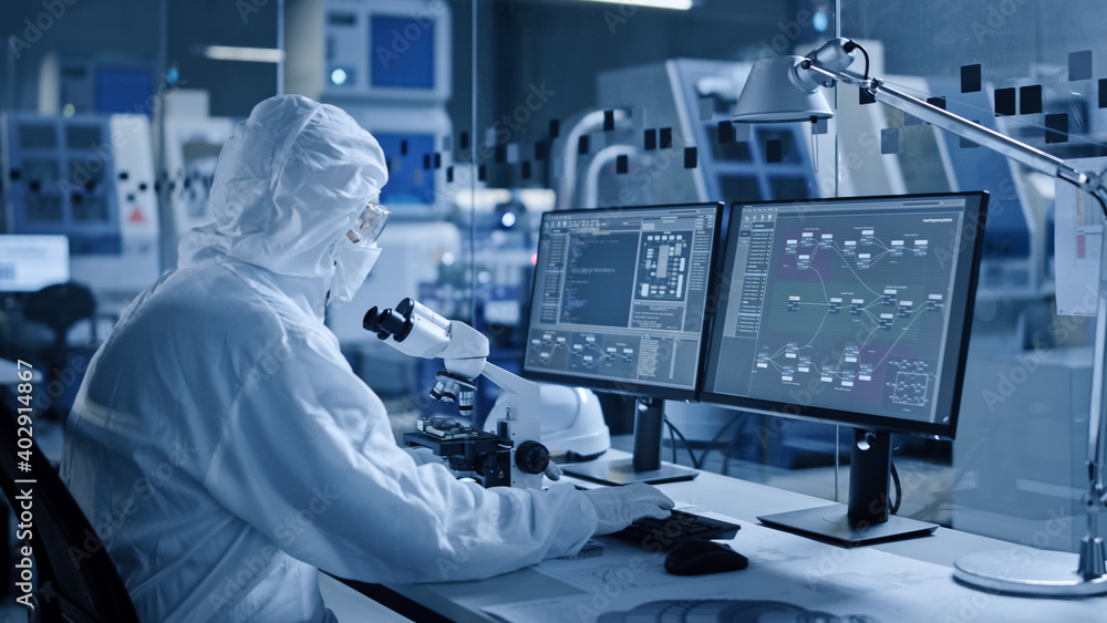 Aufkleber Electronics Factory Cleanroom: Engineer / Scientist in Coveralls Works on Computer, Screen Shows Infographics and Software System Control UI, Developing Electronics for Medical Electronics