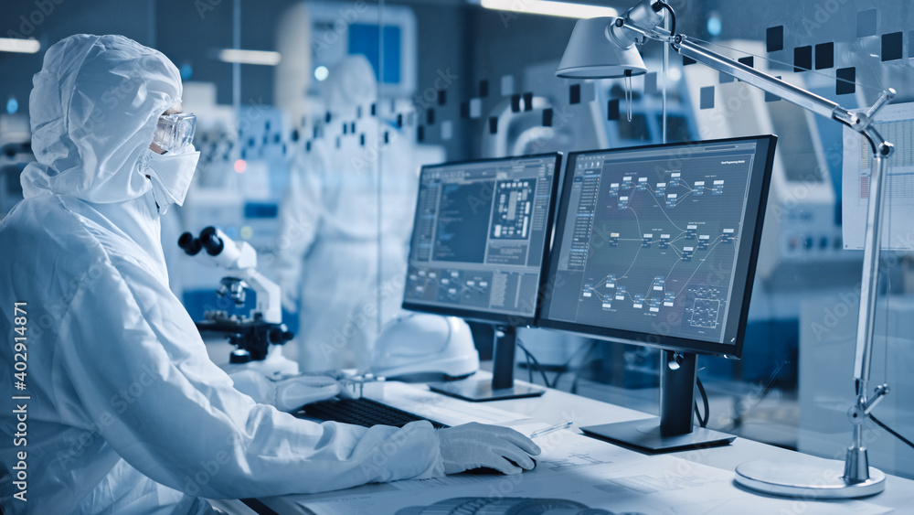 Aufkleber Electronics Factory Cleanroom: Engineer / Scientist in Coveralls Works on Computer, Screen Shows Infographics and Software System Control UI, Developing Electronics for Medical Electronics