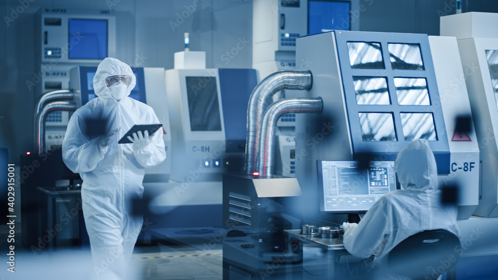 Aufkleber research factory cleanroom: engineer wearing coverall and mask, walking through workshopop uses tabl