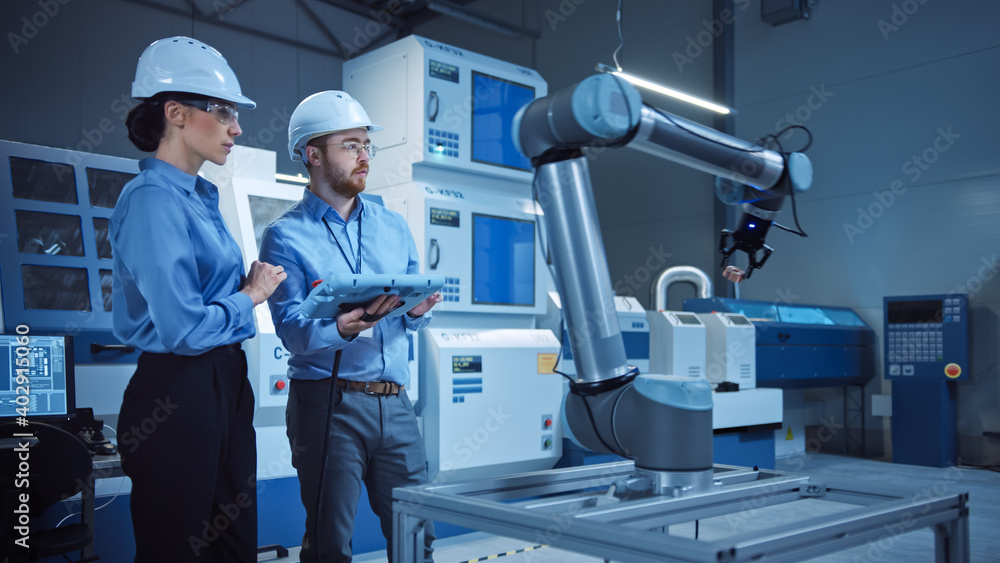 Poster factory workshop: professional female engineer, male machinery operator use industrial digital table
