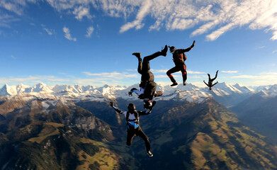 Skydivers perform stunts over Swiss Alps