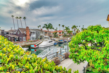 Long Beach coastal neighborhood landscape with boats and docks on the canal
