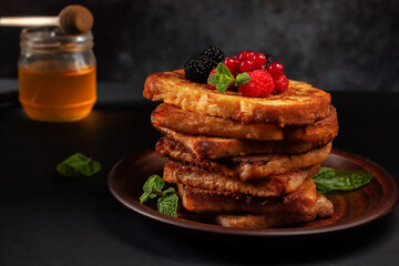 French toast with cinnamon with mulberry, raspberry and mint for coffee or tea. Morning breakfast