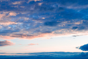 Dramatic evening sunset sky with dark clouds