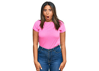 Young latin girl wearing casual clothes afraid and shocked with surprise expression, fear and excited face.