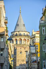 Famous historical and tourist place Galata tower in Istanbul, Turkey with blue sky background