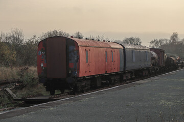 Fototapeta na wymiar Abandoned train carriages at Oswestry station