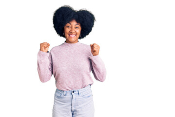 Young african american girl wearing casual clothes celebrating surprised and amazed for success with arms raised and open eyes. winner concept.