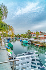 Fototapeta na wymiar Canal landscape in a coastal neighborhood with stunning resort like scenery