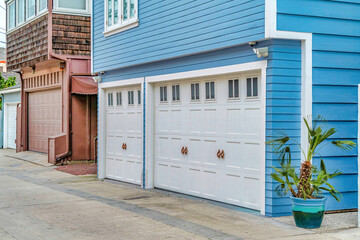 Fototapeta na wymiar Exterior view of houses in Long Beach California featuring attached garages