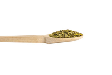 Dried leaves of yerba mate tea on wooden spoon isolated on white background. nutrition. Traditional...