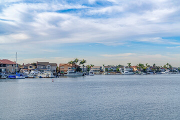 Fototapeta na wymiar Scenic panoramic view of the sea with harbor and houses in Huntington Beach CA