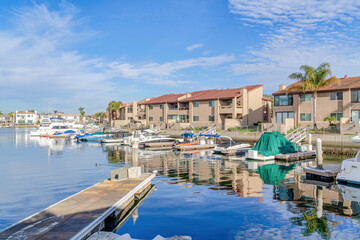 Fototapeta na wymiar Beautiful harbour views with boats and docks in Huntington Beach California