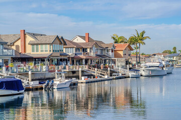 Fototapeta na wymiar Houses in Huntington Beach California overlooking the beautiful harbor scenery