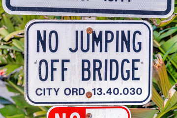 Close up view of No Jumping Off Bridge sign in Huntington Beach California