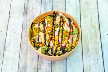 bowl of Hawaiian salad on wooden table