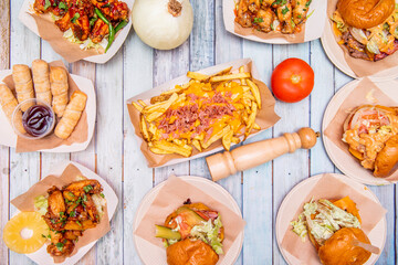 overhead shot of hamburgers and snacks