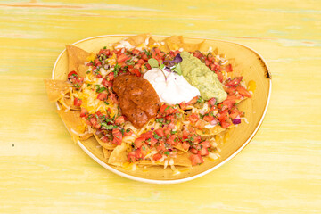 plate of mexican nachos with everything
