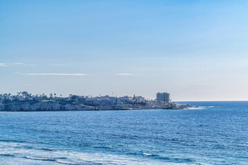 Beautiful calm ocean bordering the coast of San Diego California against sky