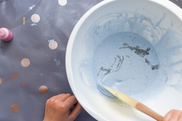 Kids activity of making slime as a science experiment for children to do indoors