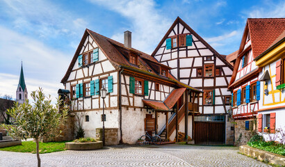 Church and half-timbered house in Rottenburg am Neckar on a sunny day in spring. Black forest,...