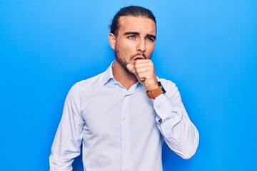 Young handsome man wearing business clothes feeling unwell and coughing as symptom for cold or...
