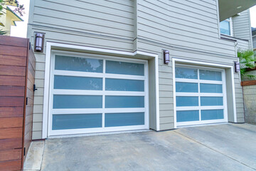 Glass doors of attached two car garage of house in San Diego California