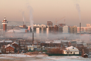 Air pollution and winter frozen fog over Yakutsk, the capital of Sakha (Yakutia) Republic at sunset