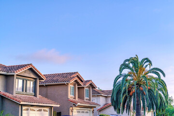 Houses in San Diego California neighborhood against blue sky on a sunny day
