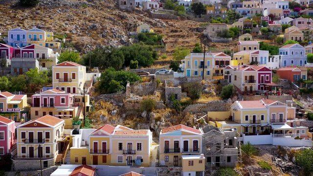 Aerial view of the beautiful greek island of Symi (Simi) with colourful houses and small boats. Greece, Symi island, view of the town of Symi (near Rhodes), Dodecanese.