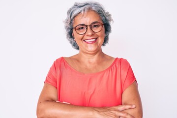 Senior hispanic grey- haired woman wearing casual clothes and glasses happy face smiling with...